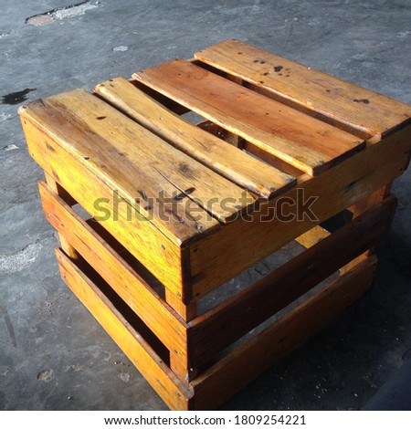square seating made of wood stacks.