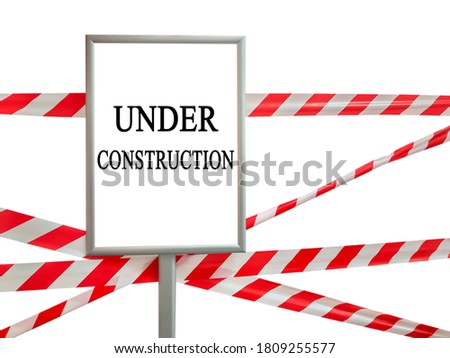 Red and white lines of barrier tape on white isolate and frame with UNDER CONSTRUCTION text inscription. Pass is forbidden, security tape. Signal tape that prohibits entry to the object. Copyspace