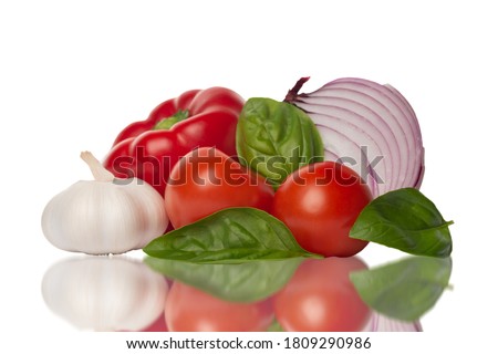 Fresh vegetables on a white background. Ingredients for Gazpacho or tomato sauce: red onion, basil, red pepper, garlic ant tomatoes.   Royalty-Free Stock Photo #1809290986