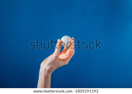 Hand Holding Ping Pong Ball On Blue Background Photo

A hand holds up a white ping ping ball in front of a bright blue background. Royalty-Free Stock Photo #1809291592
