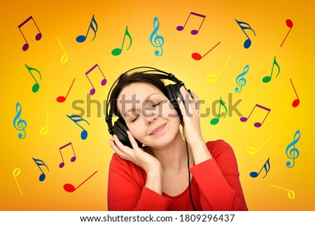 Smiling happy woman with headphones and closed eyes listening to music surrounded by colorful musical notes