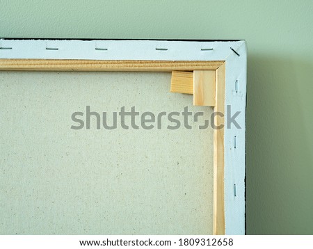 Back side of the canvas frame for acrylic painting in the art class. canvas painted pictures frame. Scratched back reverse side for framed painting, image on wooden stretcher. Abstract background for
