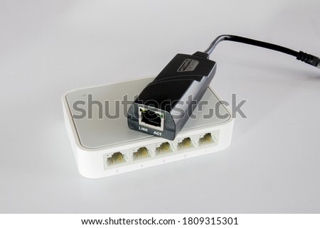 USB 3.0 gigabit lan in black colour on lan hub, isolated on a white background.
