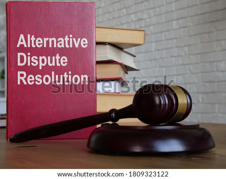 Alternative dispute resolution ADR is shown on the conceptual business photo