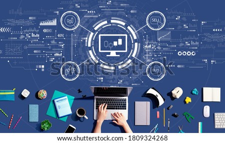 Stock trading theme with person using a laptop computer