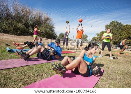 Group of mature adults working out in fitness class