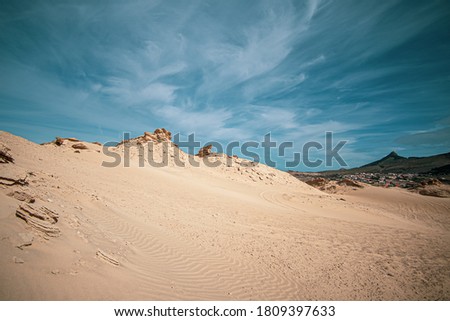 Sand dunes, blue sky and clouds