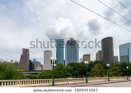 View of the Houston Skyline During the Day from Side Walk on Bridge