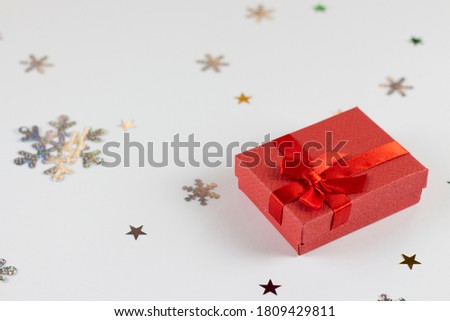Flatley Christmas. Festive Christmas background. New Year's and Christmas. Christmas card background. Red gift and snowflakes on a white background. Copyspace