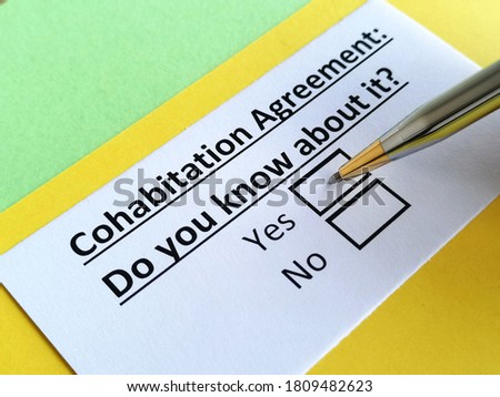 One person is answering question about cohabitation agreement. Royalty-Free Stock Photo #1809482623