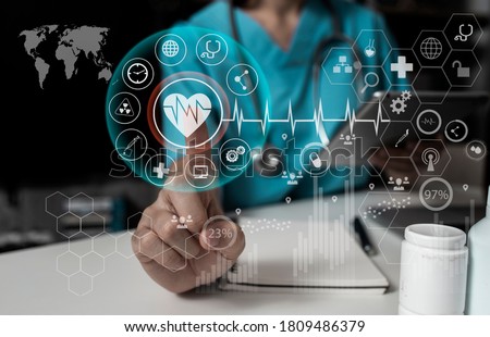 Double exposure of Doctor working with tablet computer and modern virtual screen interface, Healthcare And Medicine concept, Blurred background.