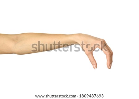 Hand picking, holding, grabbing or reaching. Woman hand gesturing isolated on white