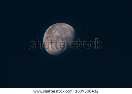 beautiful picture of half moon , sharp and clear image of  blue moon
 