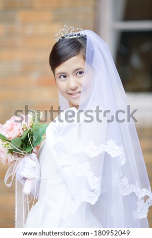 Japanese Bride smiles with a bouquet