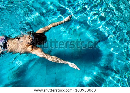 Woman swimmer with shadow and halo Royalty-Free Stock Photo #180953063