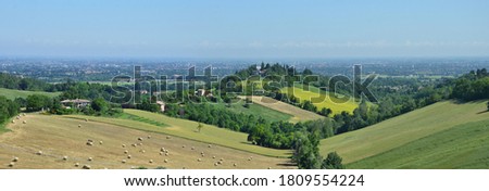 Summer day on the hills of Reggio Emilia overlooking the Po Valley Royalty-Free Stock Photo #1809554224