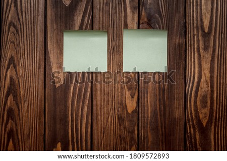 wooden background with a beautiful texture. two blank stickers for text. mockup. advertising poster, bulletin board, web site page. Two blank stickers, planning concept. Place for text, copy space.