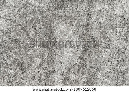 The bare cement wall background can be used as a design background.