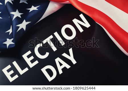 Waving american flag and inscription election day. USA election concept.