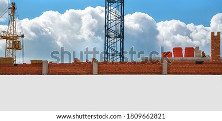 large white empty hoarding with mockup place on construction site with brickwork background outdoor
