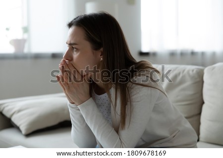 Young frustrated worried woman feeling stressed of difficult life situation. Doubtful unhappy millennial girl suffering from psychological problem, thinking of hard decision, depression concept. Royalty-Free Stock Photo #1809678169