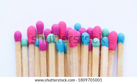 Bright colorful matches isolated on white background. Macro, close up, top view. Royalty-Free Stock Photo #1809705001