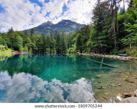 Blue Lake is a small lake, in Switzerland, in the Kander valley above Kandergrund at 887 metres, near the river Kander. Administratively, it belongs to the Bernese Oberland. Royalty-Free Stock Photo #1809705244