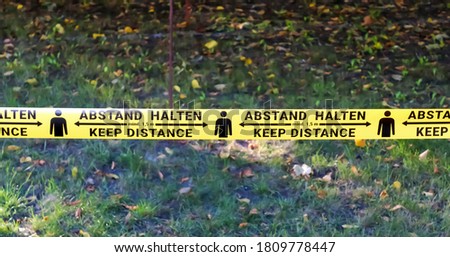 1.5 meter social distancing sign for COVID-19. Keep distance symbol in german language saying Bitte Abstand halten