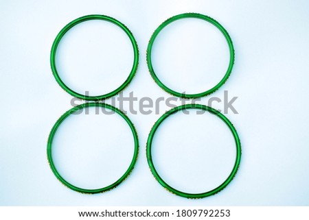 Green bangles isolated on white background, wedding Traditional green bangles. Royalty-Free Stock Photo #1809792253