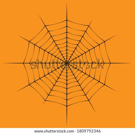 black spiderweb with orange background