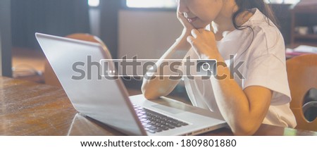 Woman using laptop searching for information in internet.