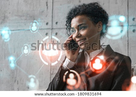 Businesswoman speaks phone and social network hologram. Double exposure.