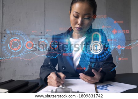 Businesswoman taking notes and lock drawing hologram. Double exposure. Education technology security solution concept.