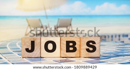 JOBS word made with wooden building blocks. Career business concept.