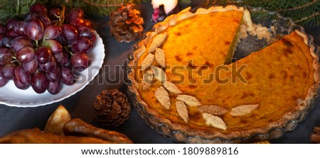 A traditional Thanksgiving dinner setting. Traditional pie and chicken. Thanksgiving Day celebration concept. Christmas or New Year. 