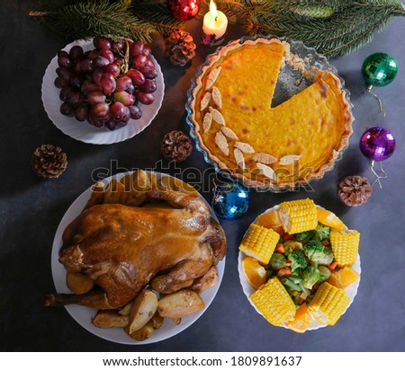 A traditional Thanksgiving dinner setting. Traditional pie and chicken. Thanksgiving Day celebration concept. Christmas or New Year. view from above.