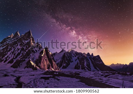 Snow mountains with dramatic starry evening galaxy Beautiful HD wallpaper Royalty-Free Stock Photo #1809900562