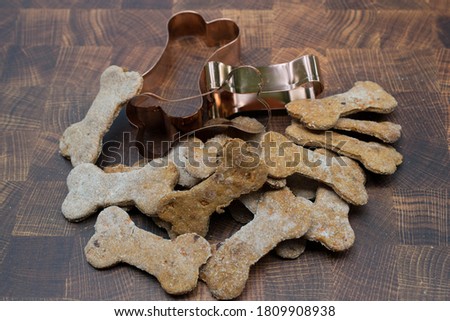 Homemade dog biscuits bone shape Royalty-Free Stock Photo #1809908938