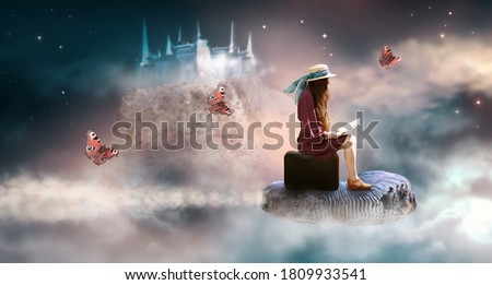 Lady woman sitting on suitcase, read book and flies on ammonite fossil through space around world, fantasy scene with ghost palace and butterflies, power of imagination concept, build castles in air. Royalty-Free Stock Photo #1809933541
