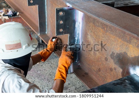 The step fourth of doing penetrant testing is step to use Developer spray into the welded to pull the liquid penetrate from the defect for Non-Destructive Testing with process Penetrant Testing(PT) Royalty-Free Stock Photo #1809951244