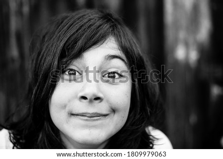 Portrait of a teen girl with big expressive eyes. Black and white photography.