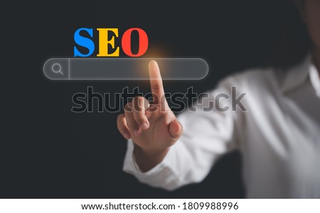 Text " SEO " with search bar over screen. concept for promoting website traffic, ranking, optimizing your website to rank in search engines or SEO.
