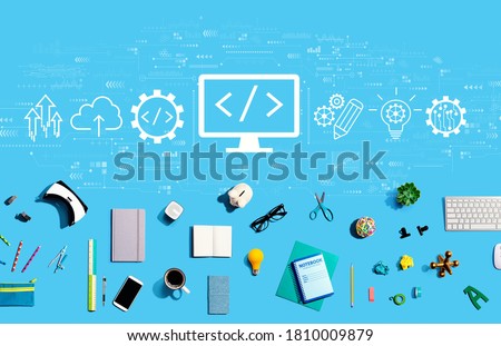 Web development concept with collection of electronic gadgets and office supplies