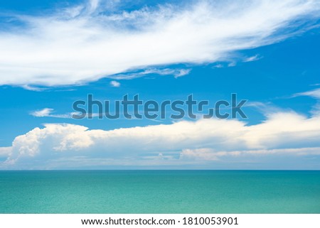 Turquoise blue sea view with blue sky and cloud background