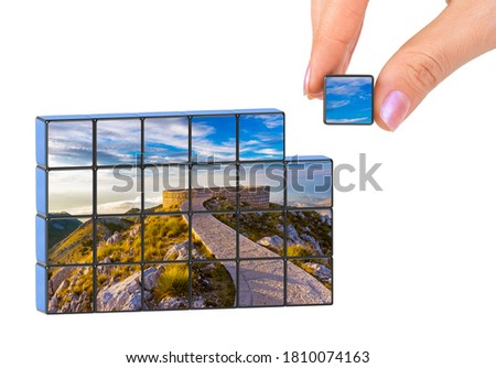 Hand and Lovcen Mountains National park - Montenegro puzzle (my photo) isolated on white background