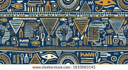 Ancient Egyptian ornament Tribal seamless pattern. Tribal art Egyptian vintage ethnic silhouettes seamless pattern in blue and gold color. Folk abstract repeating background texture. Logo design Royalty-Free Stock Photo #1810083145