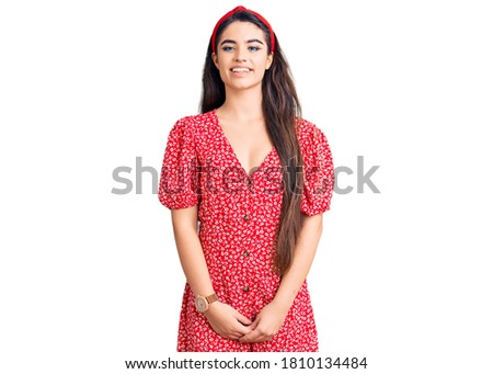 Brunette teenager girl wearing summer dress with a happy and cool smile on face. lucky person. 