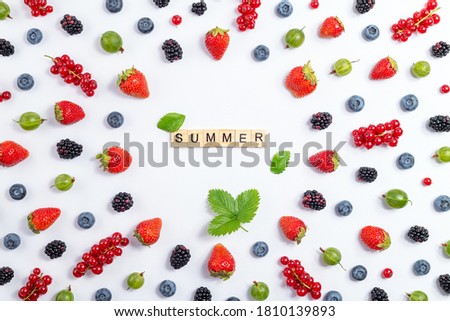 Strawberry, blueberry, blackberry, gooseberry, red currant on white background, top view. Berries pattern, flat lay. Frame made of fresh berry on white background. Creative food concept