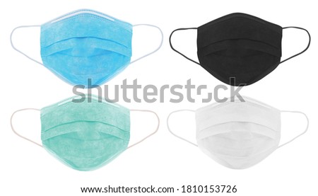Set of 4 different colours of surgical protective mask to prevent coronavirus. Medical mask of various colours for protection against flu and other diseases - image Royalty-Free Stock Photo #1810153726