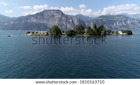 Aerial picture of Dolomites and Trimelone Island is an islet of Lake Garda administratively belonging to Brenzone located between Cassone and Assenza one hundred meters from the coast